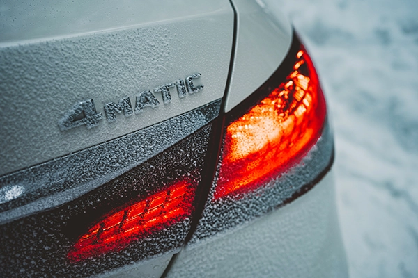 4Matic badge on rear of Mercedes vehicle covered in snow
